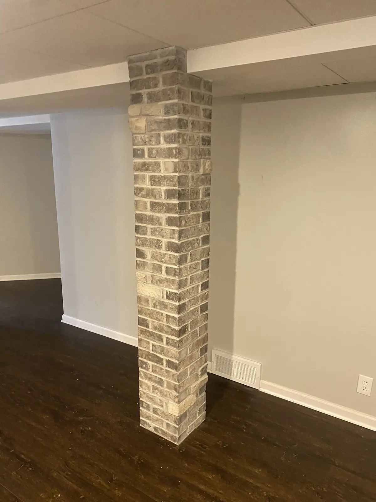 Brick column between garage doors