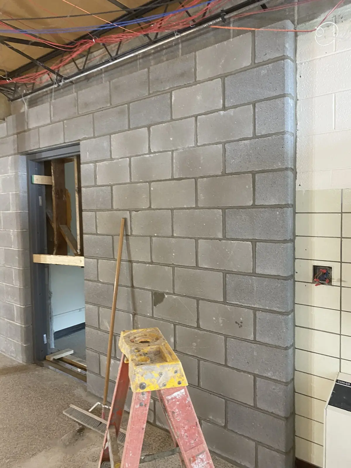 CMU block wall with door frame, commercial build-out