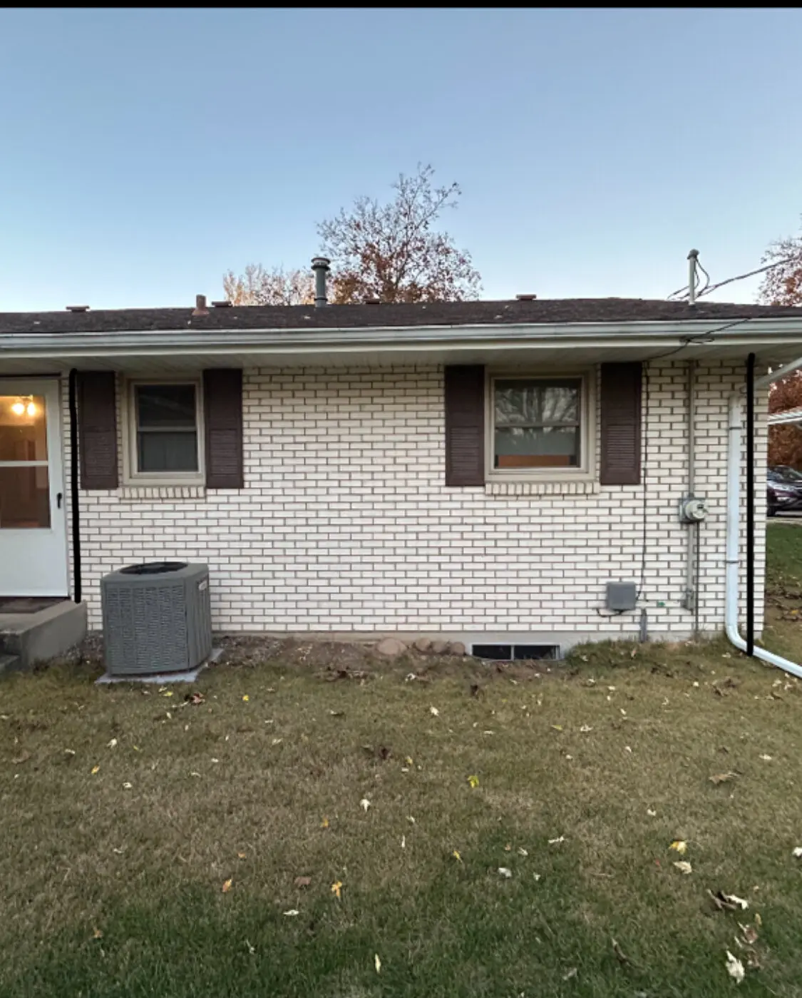Existing brick exterior before removal