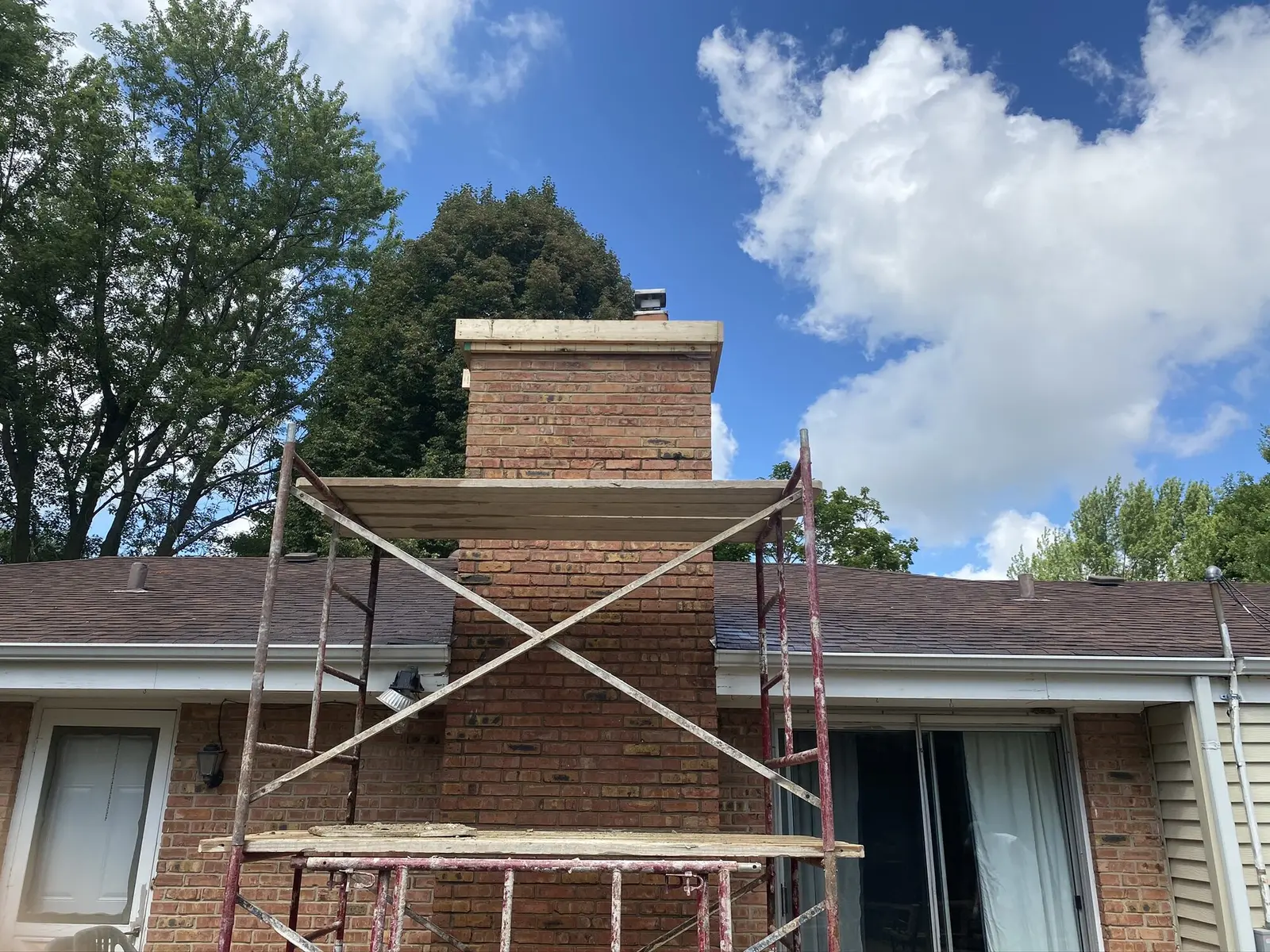 Brick chimney rebuild in progress
