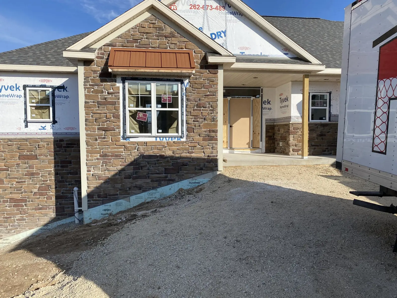 Stone veneer entry porch installation